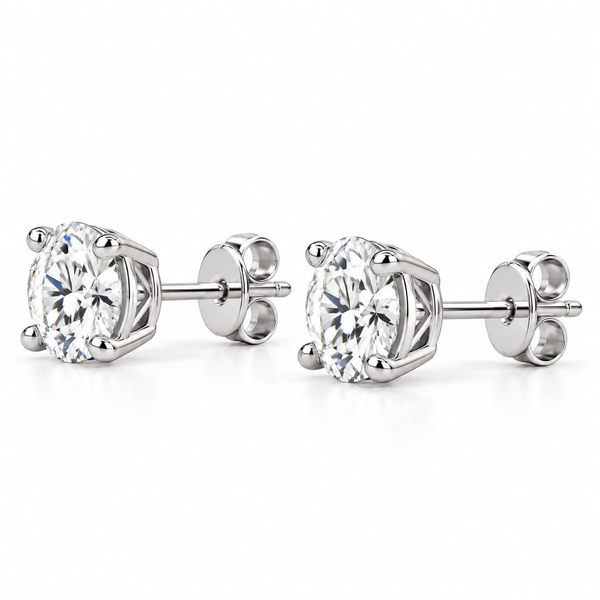 Side profile of lab-grown diamond stud earrings showing the 14k white gold four-prong basket setting, post and push back