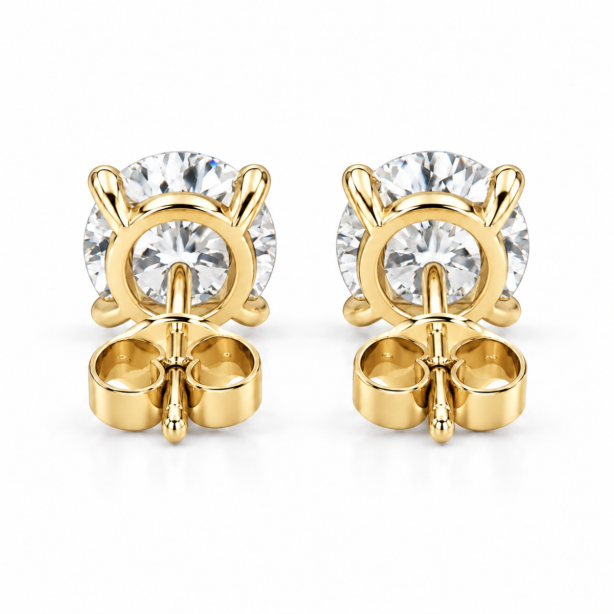 Back view of lab-grown diamond stud earrings showing the 14k yellow gold basket, post and push backs