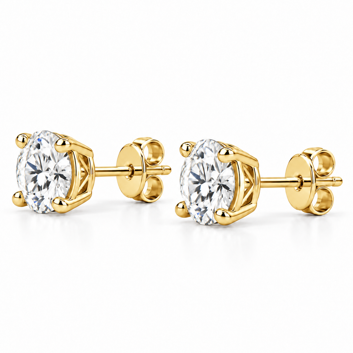 Side profile of lab-grown diamond stud earrings showing the 14k yellow gold four-prong basket setting, post and push back